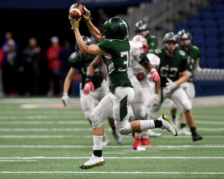 Great action shots of high school football player making amazing plays during a football game