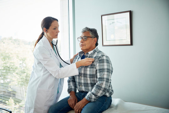 Doctor examining man