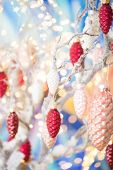 Christmas greeting card. Pine decoration on bokeh background. New Year concept. Copy space.