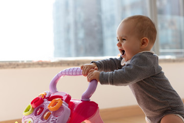 Happy baby girl excited to walk