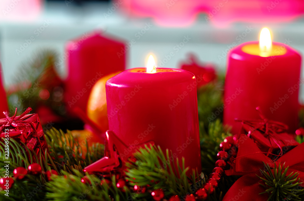 Wall mural advent wreath in red gold candles with snow as background and not yet lit candles