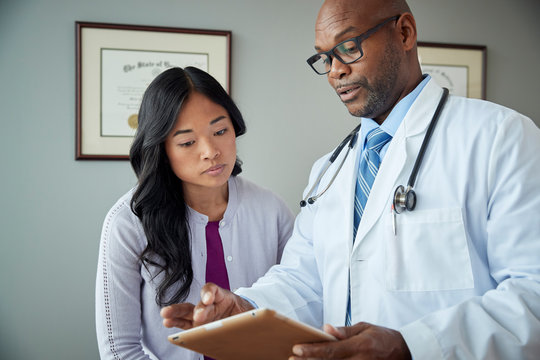 Doctor and patient review medical results