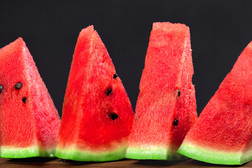 Four triangular wedges of watermelon