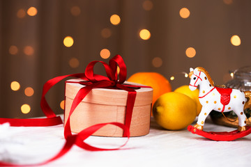 Christmas holidays composition  with copy space for your text. Christmas gift box in craft paper with red ribbon.