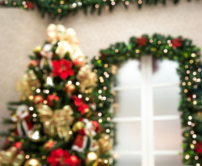 Room decorated with christmas tree and garlands