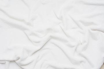 white crumpled blanket, top view