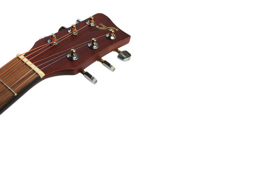 Close up of an acoustic guitar.tuning keys isolated on a white background