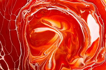 Texture of paint in white red orange colors.