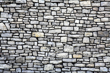 An old wall made of limestone looks very nice
