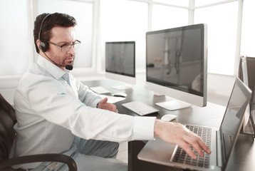 business center employee sitting at his Desk