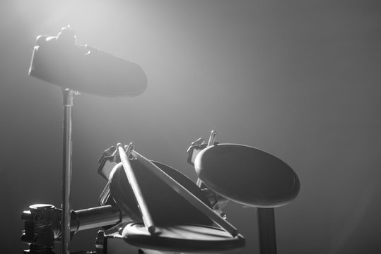 Drum sticks are on the electronic drum. Theme music. 