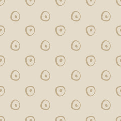 Simple abstract hand drawn light brown circle shapes on a khaki background. This seamless vector pattern is perfect for textiles, fashion, gift wrapping paper, wallpaper, scrapbooking and paper.