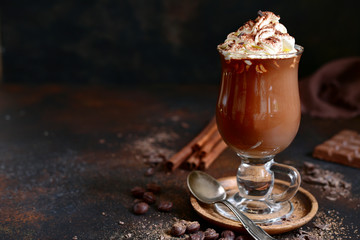 Homemade spicy hot chocolate with whipped cream in a glass.