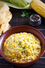 Sweet and creamy corn in bowl. Corn dish.  vertical