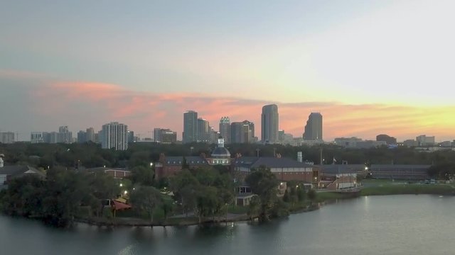 122. Downtown Orlando Golden hour Aerial dolly in revealing