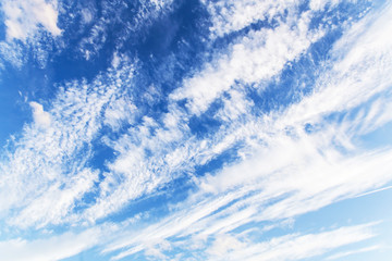 Naklejka na ściany i meble Blue white abstract background. White clouds against bright blue sky