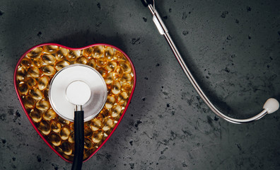Top view of heart shaped box and stethoscope. Prophylactic examination of the heart, hypertension...