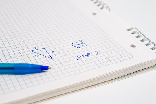 The man solves the mathematical task using the pitagoras pattern. Solving mathematical tasks, learning mathematics. Concept of problems with counting, patterns.