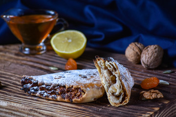 National Georgian dessert. Rols with lemon honey and dried fruits.