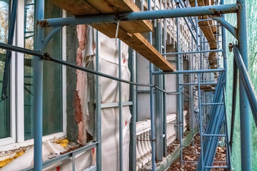 Construction site restoration work on the renovation of the old facade of the building