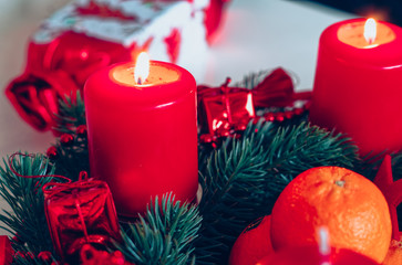 Advent wreath in red gold candles with snow as background and not yet lit candles