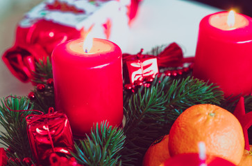 Advent wreath in red gold candles with snow as background and not yet lit candles