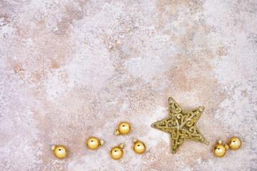 Fototapeta na wymiar Christmas background. Golden Christmas ornaments and golden star on colorful background. Copy space.