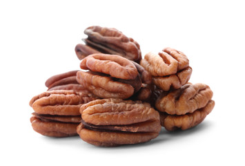 Heap of ripe shelled pecan nuts on white background