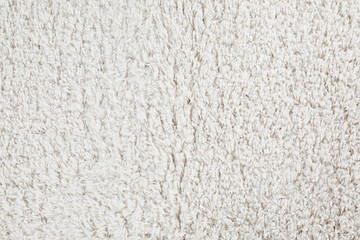 Light fuzzy carpet as background, top view. Interior element