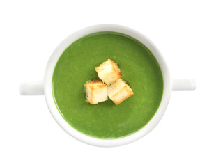 Fresh vegetable detox soup with croutons in dish on white background, top view