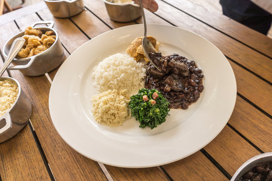 White dish with ingredients of feijoada, typical food of Brazil