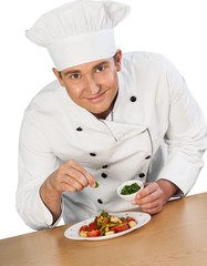 Chef garnishing a dish