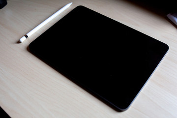 new pro tablet on the table with pencil blank screen