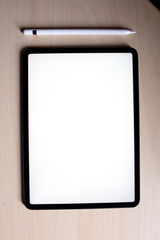 new pro tablet on the table with pencil blank screen