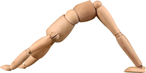 Wooden figurine exercising  on white background