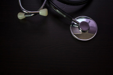 Top view of Stethoscope on black background with copy space