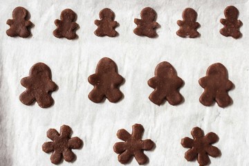 Gingerbread man cookies cut outs ready to bake /Christmas baking concept