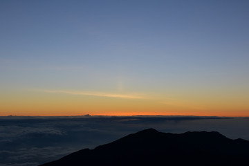 Sunrise at the summit of Haleakala volcano on the island of Maui, Hawaii.