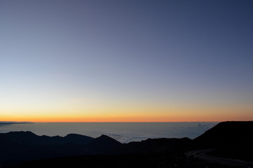 Sunrise at the summit of Haleakala volcano on the island of Maui, Hawaii.