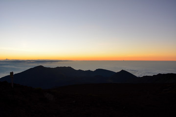 Sunrise at the summit of Haleakala volcano on the island of Maui, Hawaii.