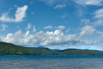 tropic beach and see , with blue sky and whit clouds