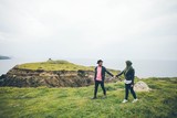 Young couple walking on the mountain