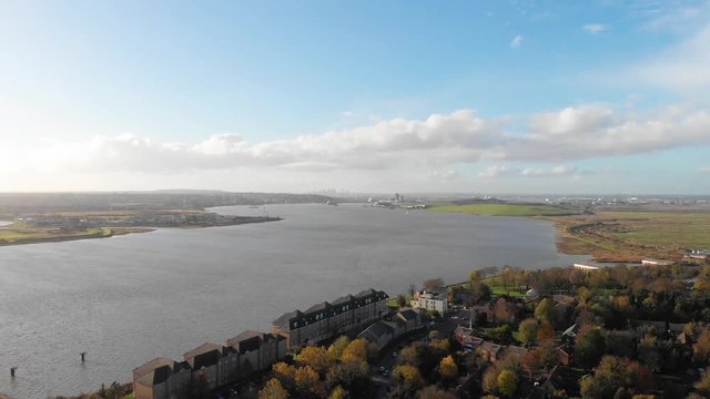 An aerial view of river Thames at Purfleet and the London skyline in the distance