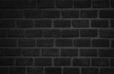 Wall stained old grungy stucco texture background. Brickwork flooring interior rock old pattern clean concrete have grid uneven design stack. Abstract kitchen wallpaper modern black brick tile.