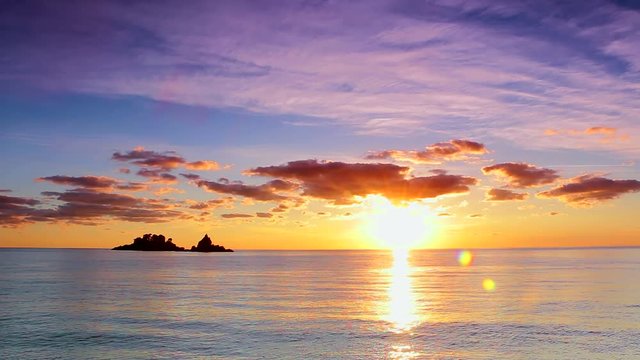 Beautiful sunset at sea and island. Beautiful sunset at sea and island in Montenegro. The island of St. Sunday and Katic, Petrovac na moru, Montenegro