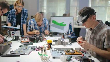 Young engineers working on scientific project