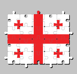 Jigsaw puzzle of Georgia flag in white rectangle, with a large red cross. four Bolnur-Katskhuri crosses on four corners. Concept of Fulfillment or perfection.