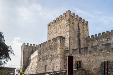 Fototapeta na wymiar Lisbon, PORTUGAL - April 23, 2018: a tower of the 'Castelo de São Jorge', was a fortress for the moors and residence of the first king of Portugal