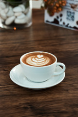 Latte Coffee art on the wooden table