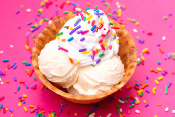 Vanilla Ice Cream in a Waffle Cone Bowl on a Pink Background
